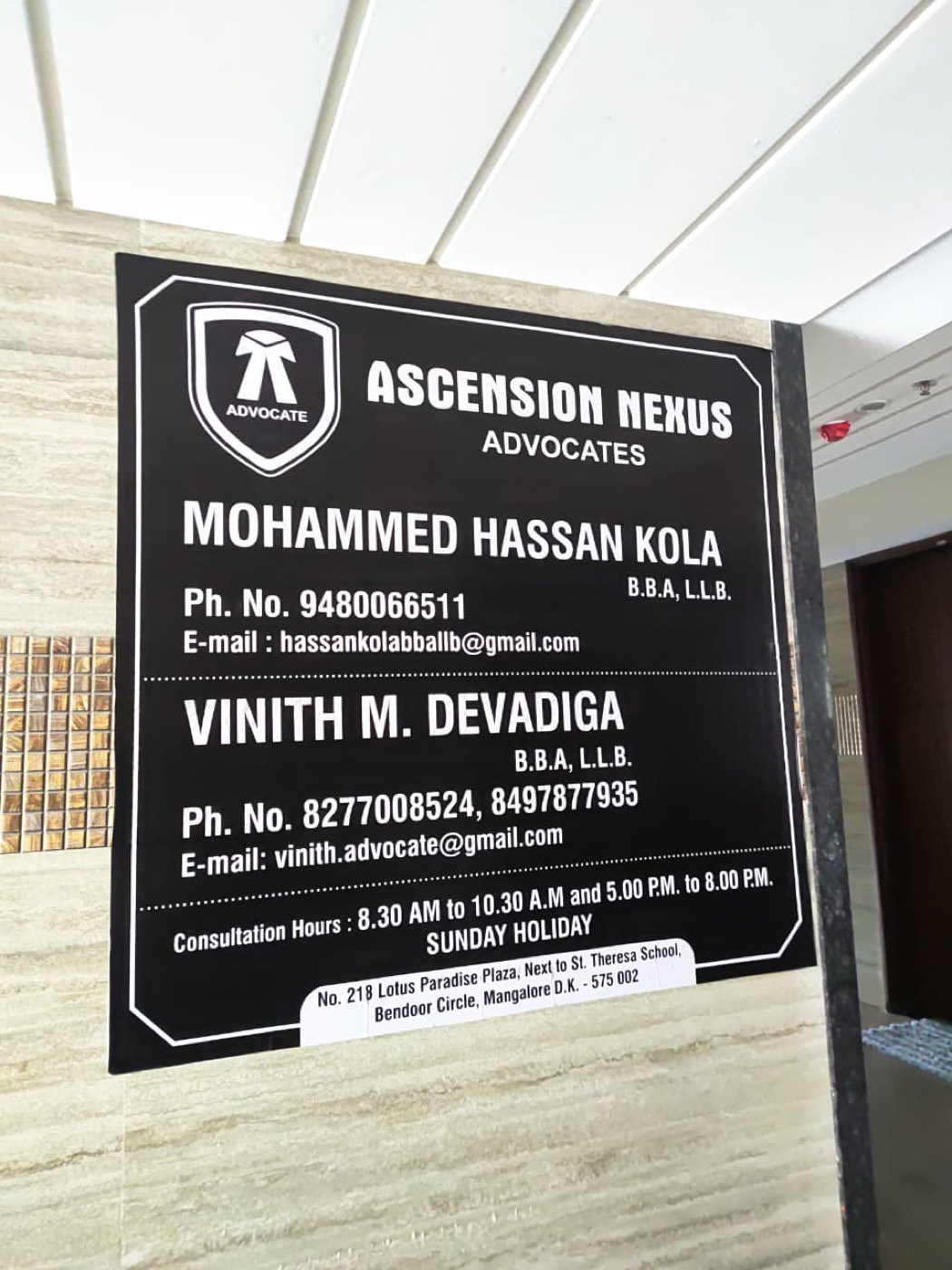 Ascension Nexus Law Chamber nameplate listing both advocates